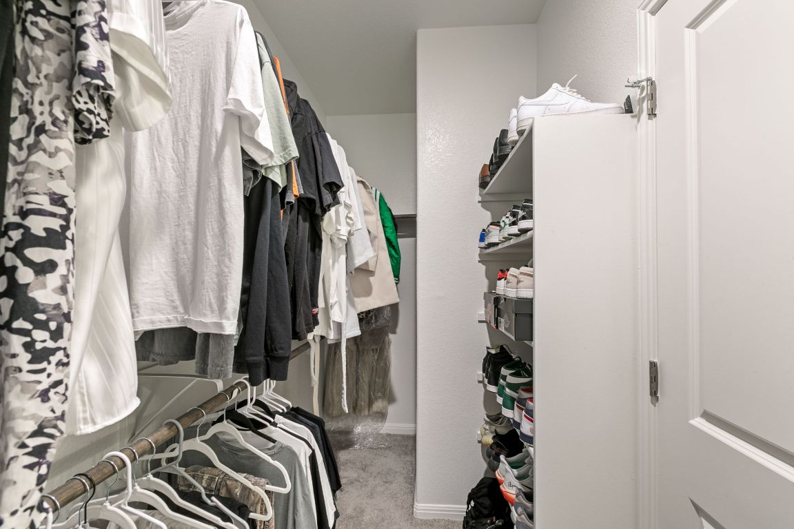 615 Backstays Loop Kyle, TX 78640 - Photo 18 of 36 a view of walk in closet with clothes and shoes