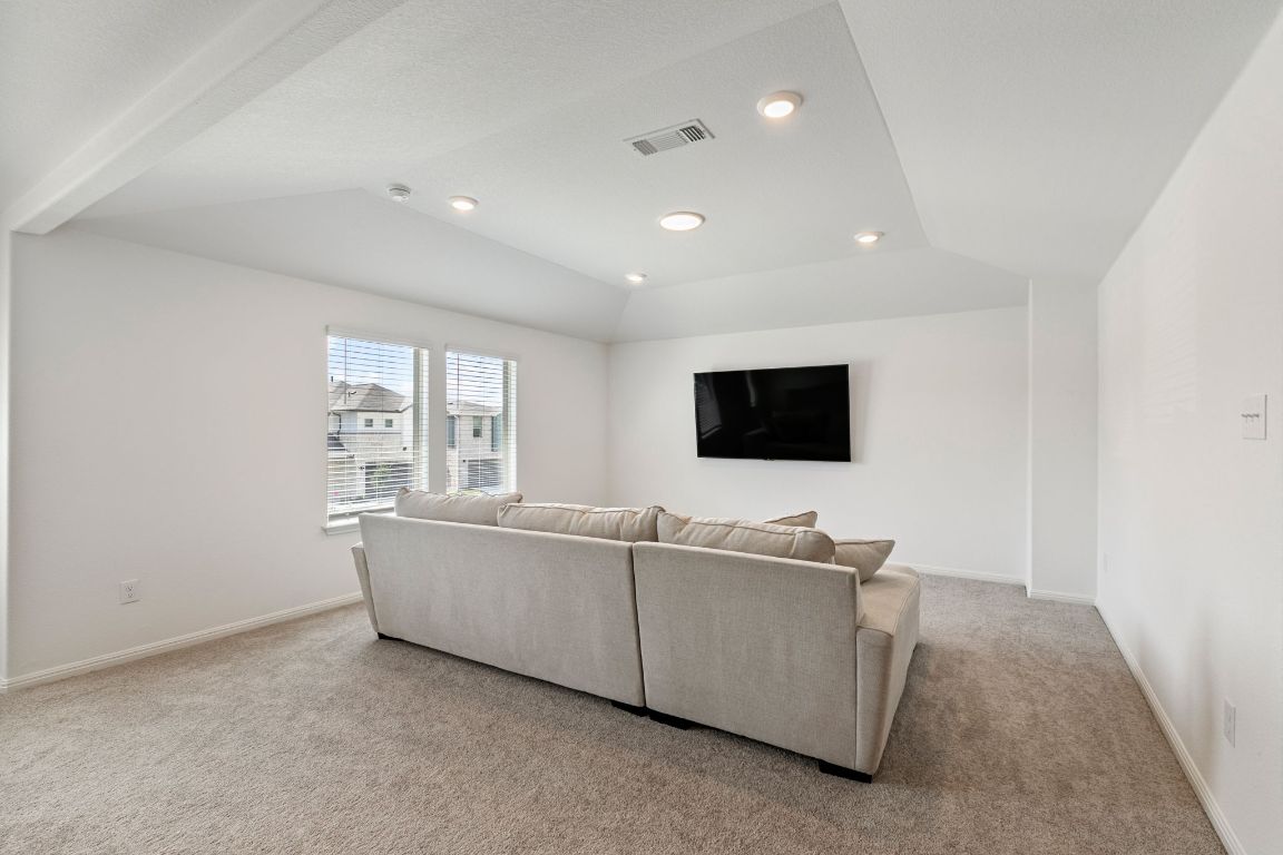 615 Backstays Loop Kyle, TX 78640 - Photo 19 of 36 a living room with furniture and a flat screen tv