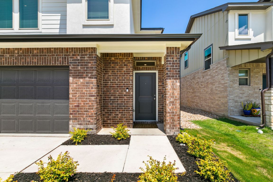615 Backstays Loop Kyle, TX 78640 - Photo 2 of 36 a front view of a house with a yard