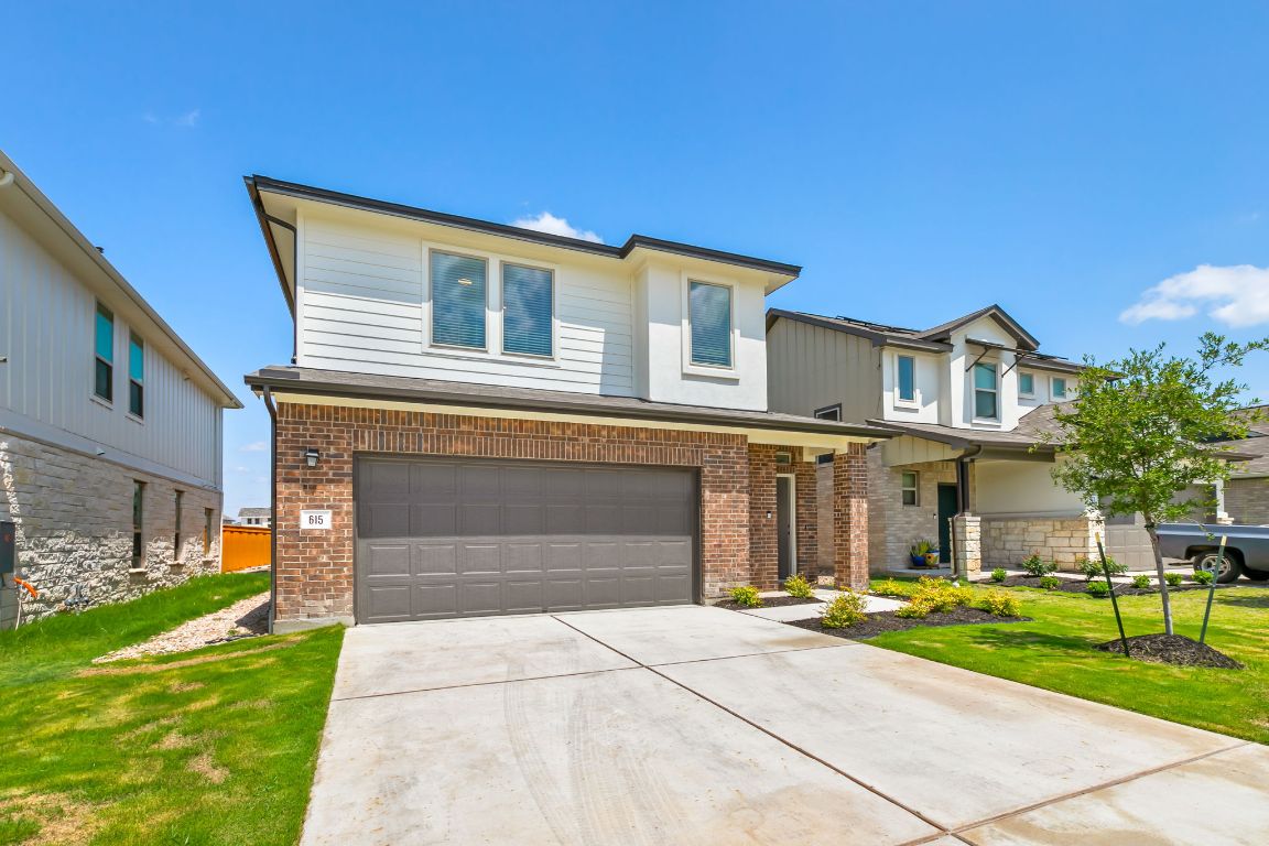 615 Backstays Loop Kyle, TX 78640 - Photo 3 of 36 a front view of a house with a yard