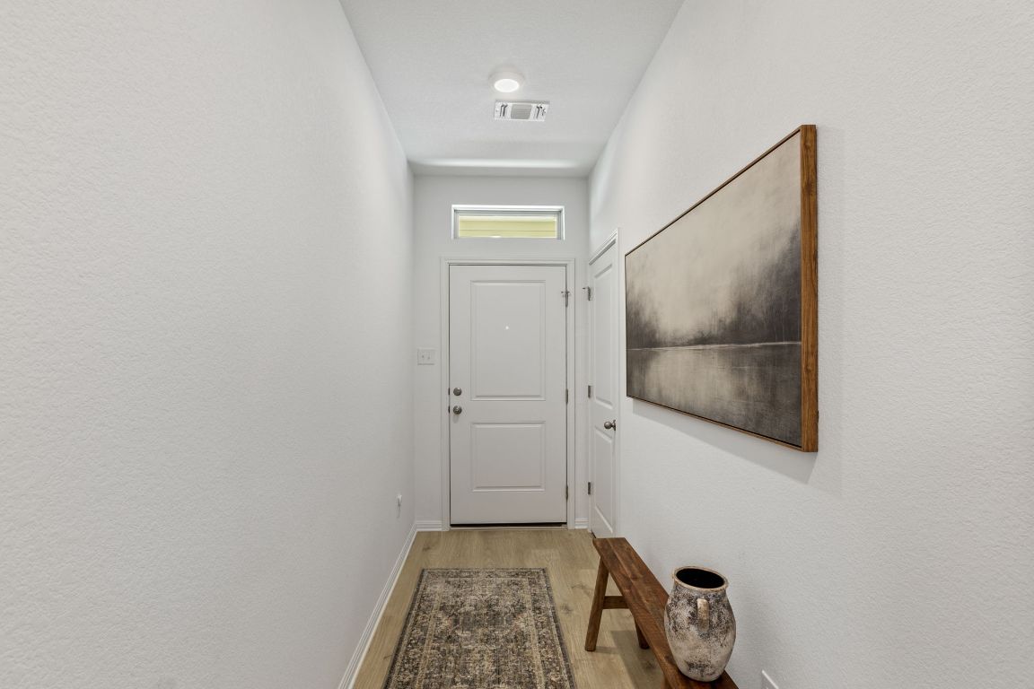 615 Backstays Loop Kyle, TX 78640 - Photo 5 of 36 a view of a front door and wooden floor