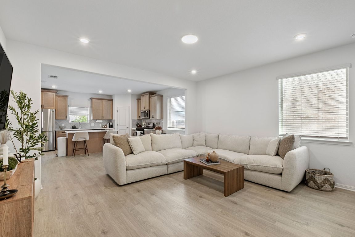 615 Backstays Loop Kyle, TX 78640 - Photo 6 of 36 a living room with furniture and a large window