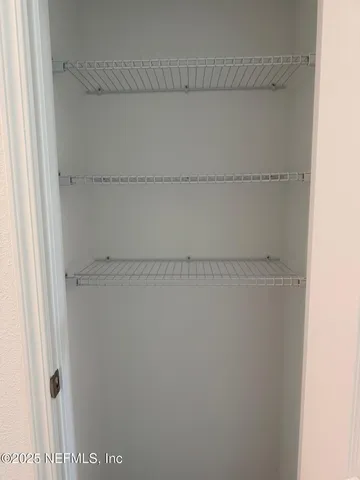 a view of a room with racks on the wall