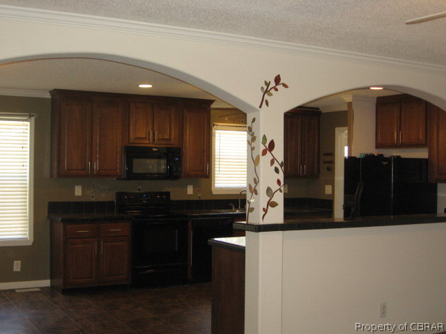 1313 Healys Road Locust Hill, VA 23092 - Photo 3 of 16 LR into kitchen