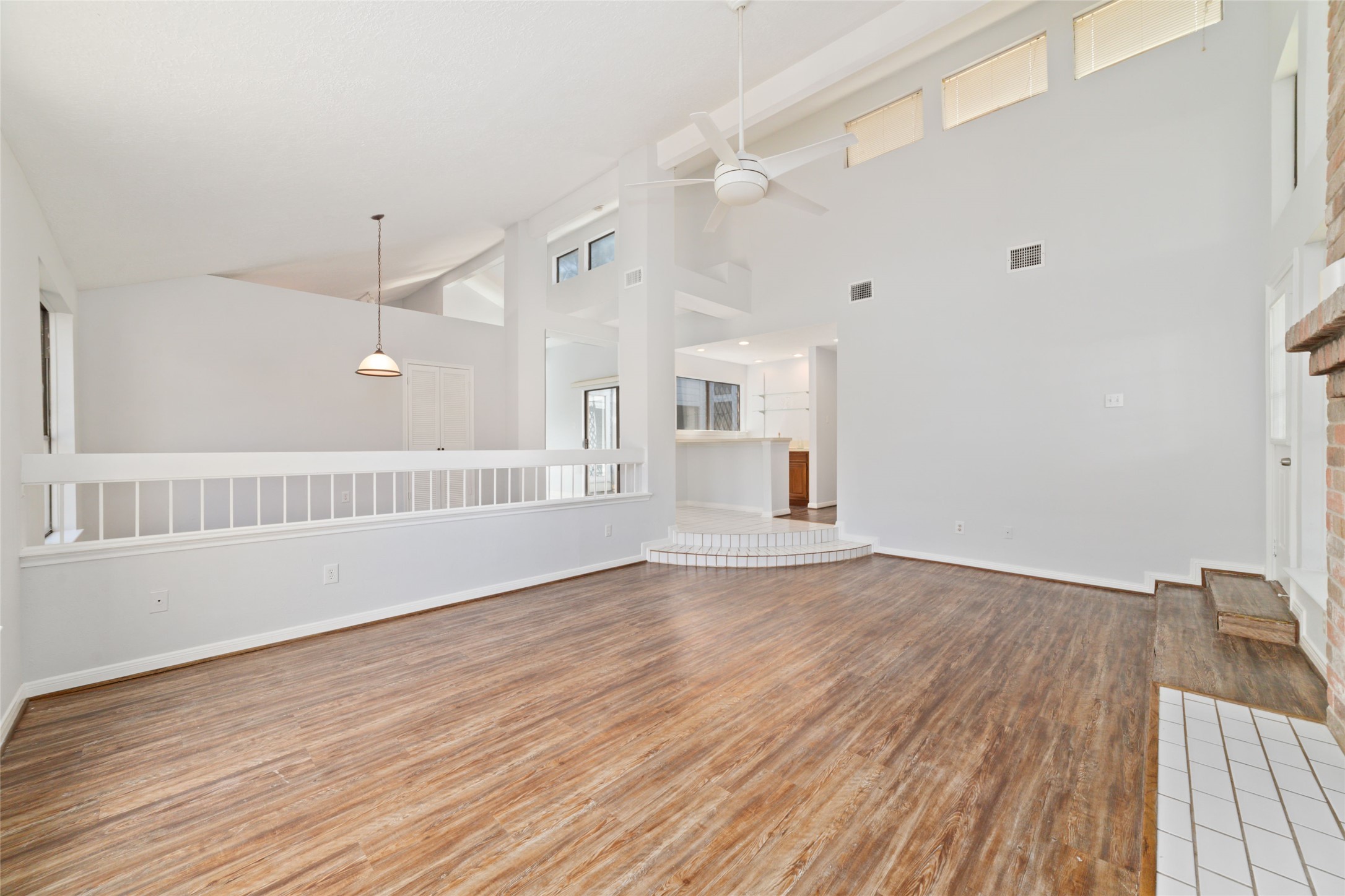 15014 Tinker Street Houston, TX 77084 - Photo 12 of 35 a view of an empty room with wooden floor and a window