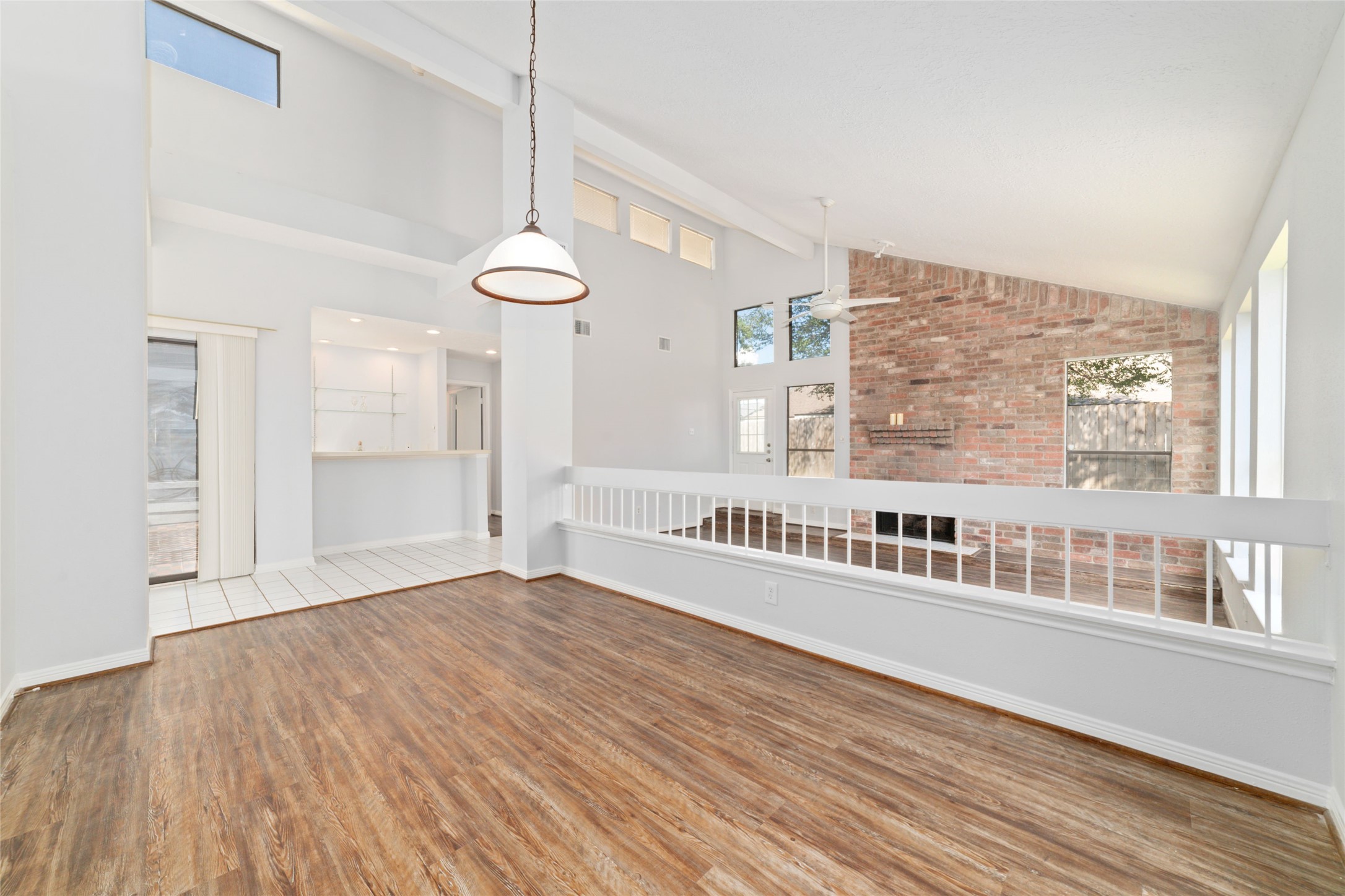 15014 Tinker Street Houston, TX 77084 - Photo 14 of 35 a view of an empty room with wooden floor and a window