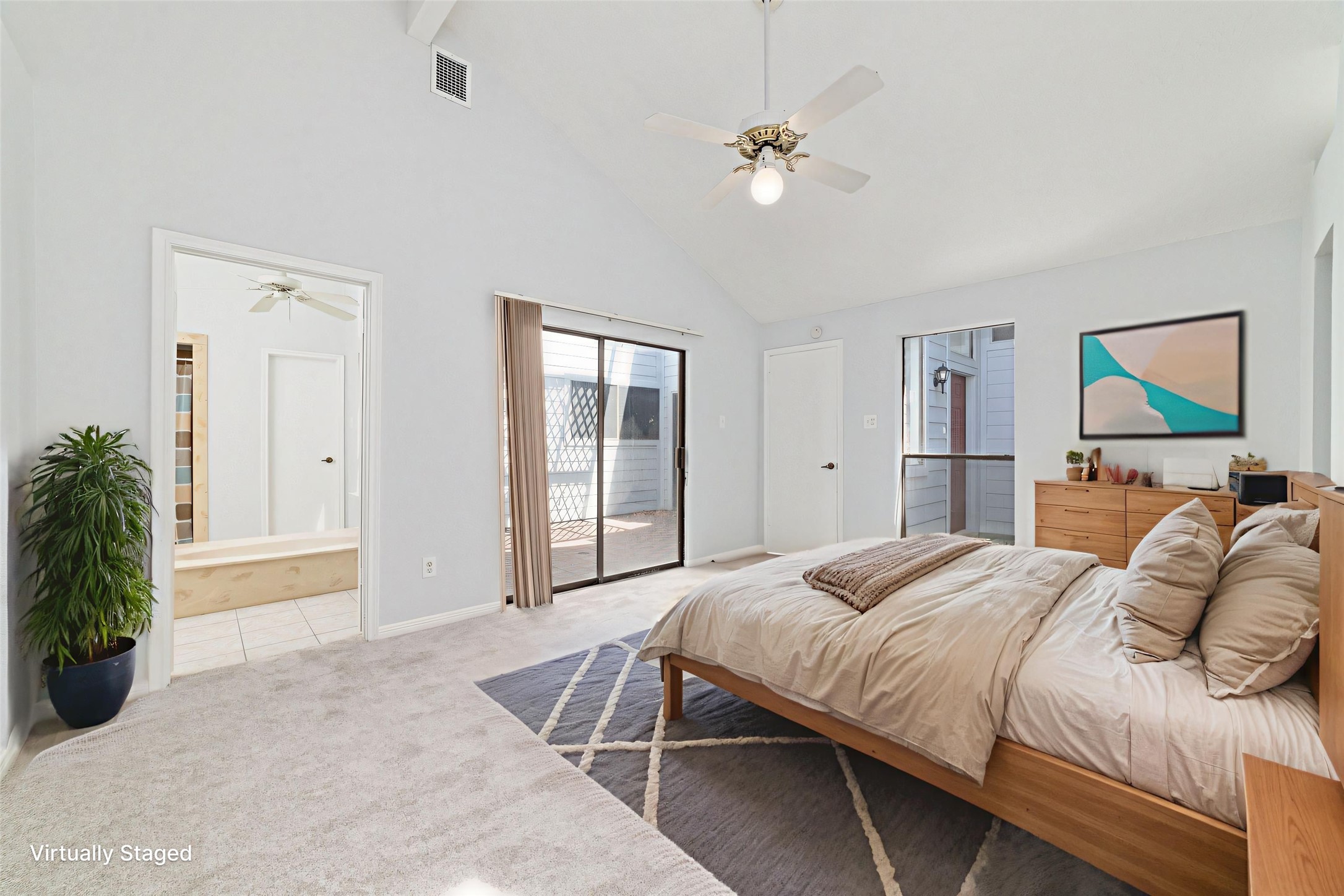 15014 Tinker Street Houston, TX 77084 - Photo 25 of 35 a bedroom with a bed and a chandelier