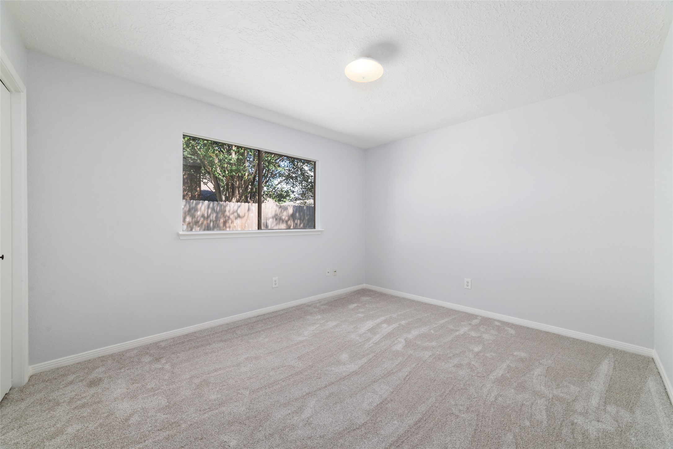 15014 Tinker Street Houston, TX 77084 - Photo 32 of 35 an empty room with a window