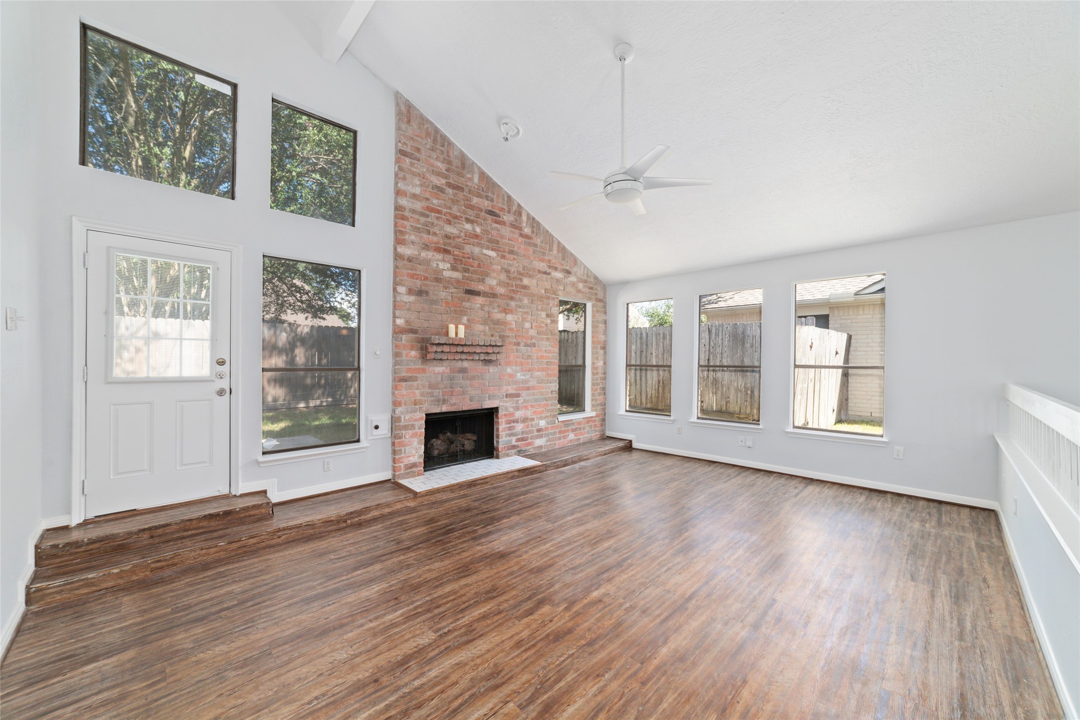 15014 Tinker Street Houston, TX 77084 - Photo 9 of 35 a view of an empty room with wooden floor and a window