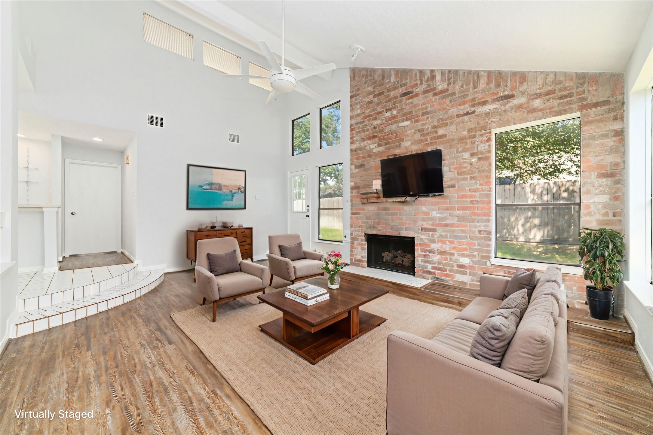 15014 Tinker Street Houston, TX 77084 - Photo 10 of 35 a living room with furniture a flat screen tv and a fireplace