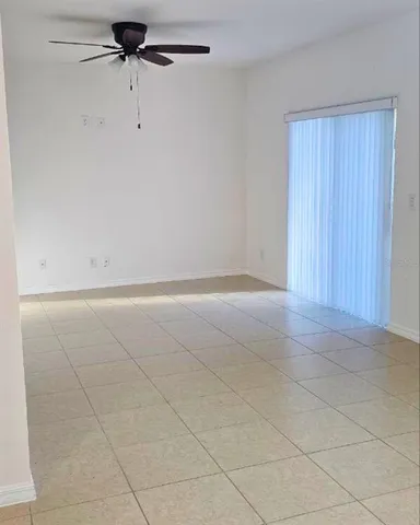 an empty room with a empty space and a window