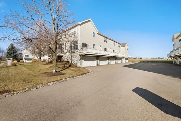 a view of a house with snow on the road