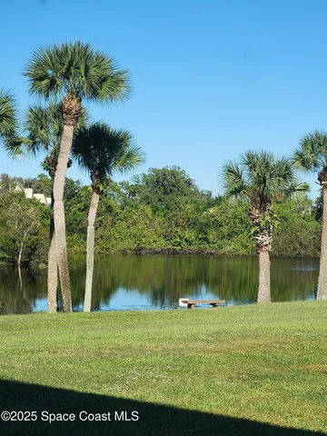 a view of a lake with a big yard