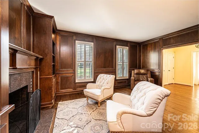 a living room with furniture and walk in closet