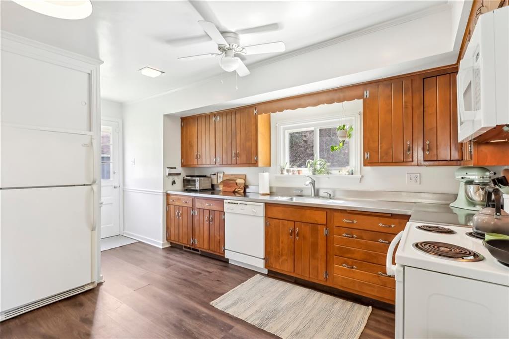 2263 Lovi Road Freedom, PA 15042 - Photo 5 of 22 a kitchen with a sink cabinets stainless steel appliances and a window