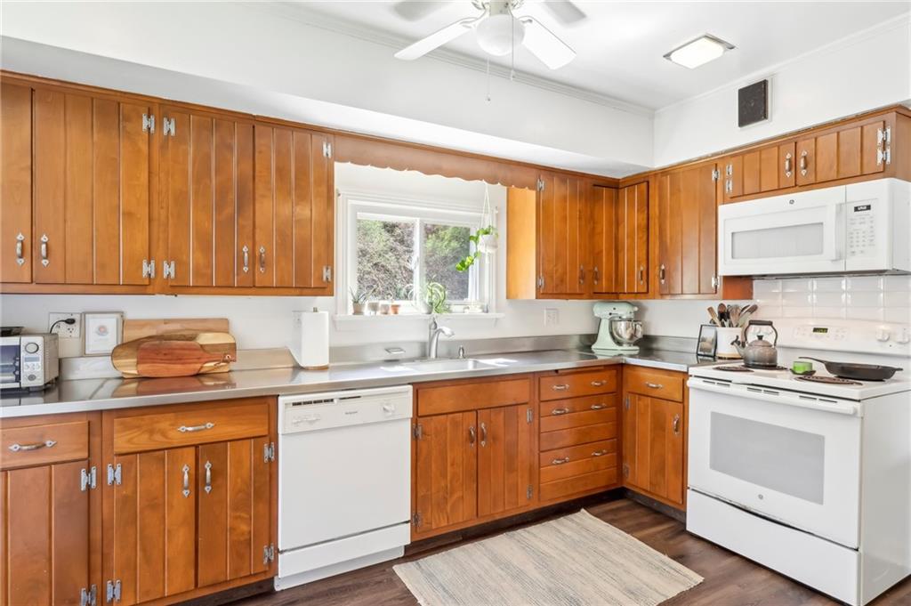 2263 Lovi Road Freedom, PA 15042 - Photo 6 of 22 a kitchen with a sink stove top oven and cabinets