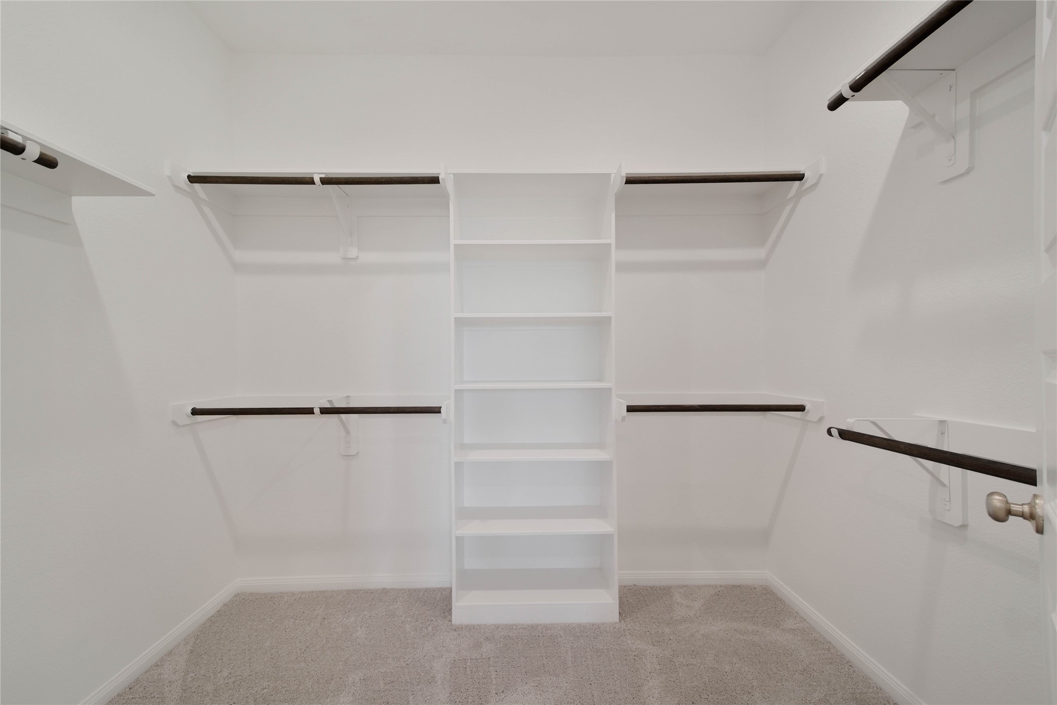 7080 Silverleaf Oak Street Conroe, TX 77304 - Photo 15 of 35 The walk-in closet offers wrap-around hanging storage and plenty of shelf space to easily fit your wardrobe.