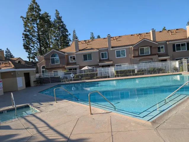 a pathway of a house with garden