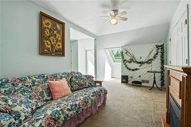 a bedroom with a bed and a couch