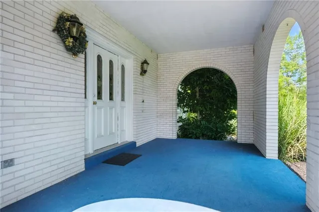 a view of an entryway with wooden floor