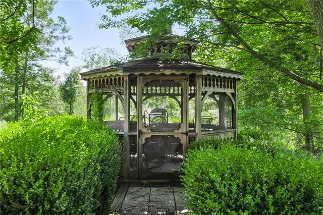 a view of a yard with an outdoor seating