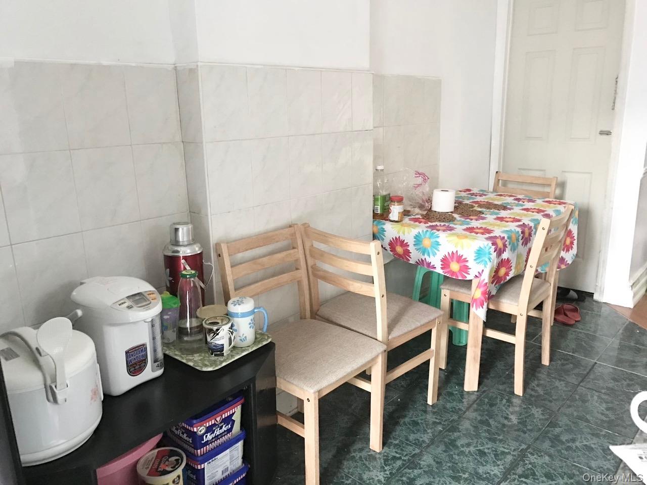 98-08 Alstyne Avenue Queens, NY 11368 - Photo 4 of 7 a view of a dining room with furniture