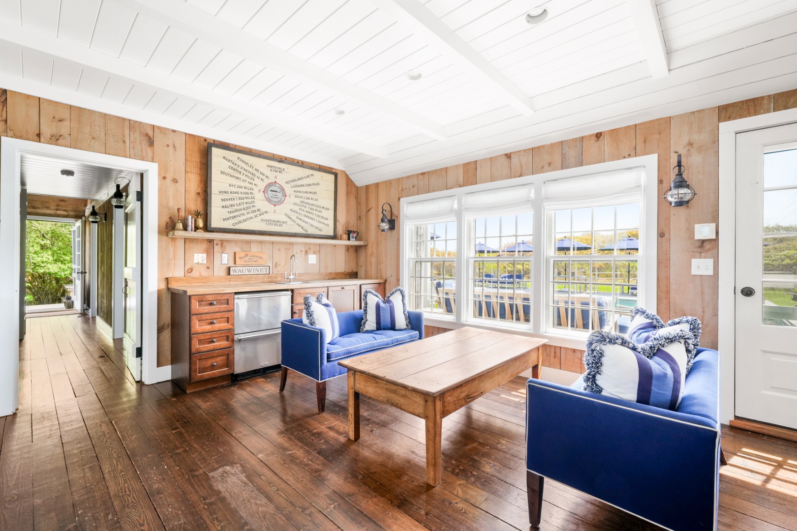 21 Quidnet Road Nantucket, MA 02554 - Photo 7 of 62 a living room with furniture and large windows