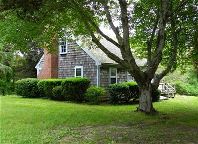 68 Cedar Land Road Orleans, MA 02653 - Photo 10 of 20 a front view of house with yard and green space