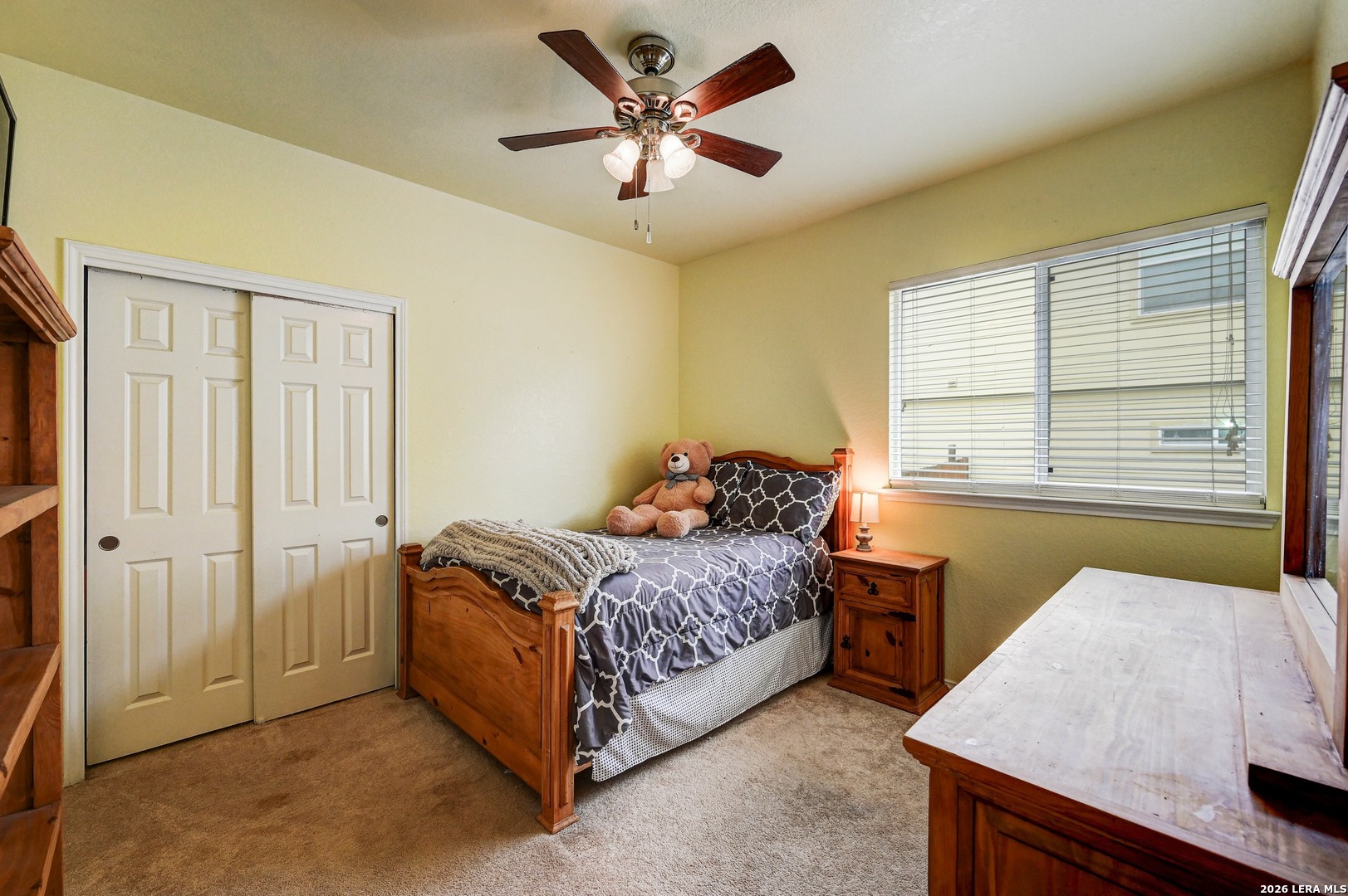 720 Hollow Ridge Schertz, TX 78108 - Photo 18 of 27 a bedroom with a bed and a table in it