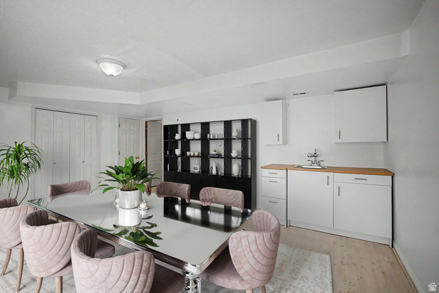 2058 California Avenue, Unit 2 Provo, UT 84606 - Photo 13 of 32 Virtually staged Dining area featuring a built-in wet bar with white cabinetry, a wood-finish countertop, and a stainless steel sink