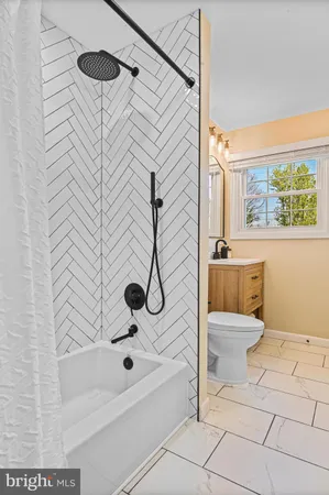 a bathroom with a bathtub and shower