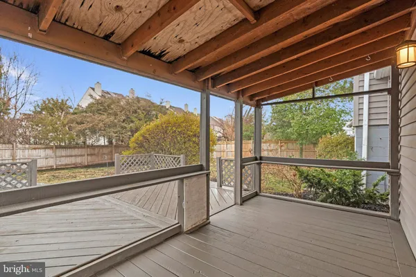 a view of a balcony with furniture
