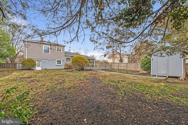 a view of a large house with a large tree