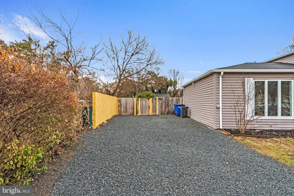 a view of a house with a yard and garage