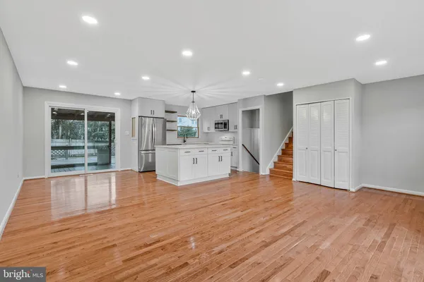 a view of kitchen with wooden floor and window