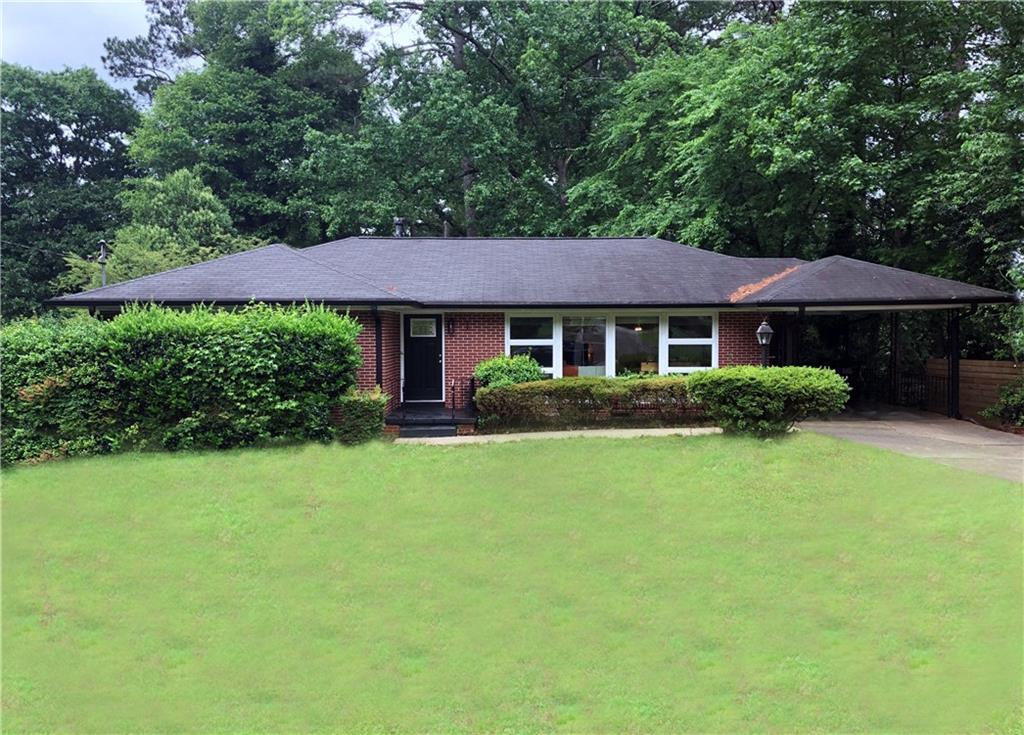 2314 Bryant Drive East Point, GA 30344 - Photo 1 of 1 a front view of a house with a garden