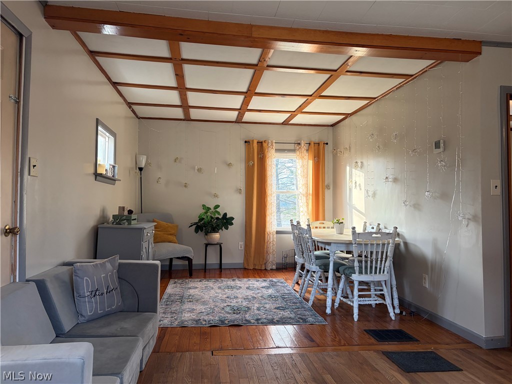 3719 Holmes Road Cambridge, OH 43725 - Photo 3 of 20 Dining area featuring hardwood / wood-style floors, plenty of natural light, and coffered ceiling