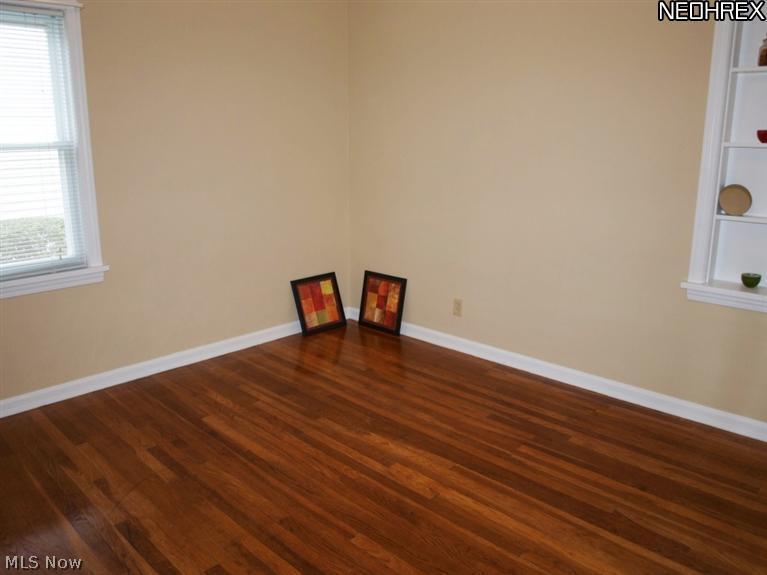 1577 Wood Road Cleveland, OH 44121 - Photo 9 of 25 1st floor bedroom with hardwood floor not laminate 12x10