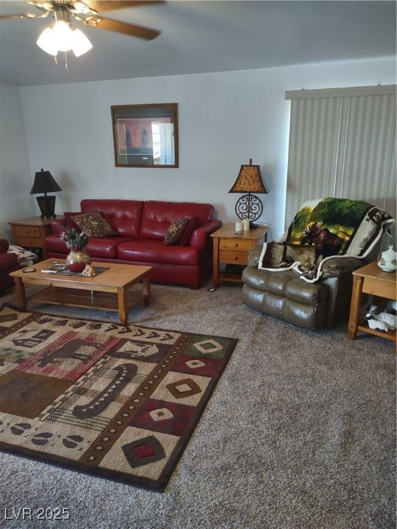 301 South Gold Street Manhattan, NV 89022 - Photo 8 of 16 Living area with ceiling fan and carpet flooring