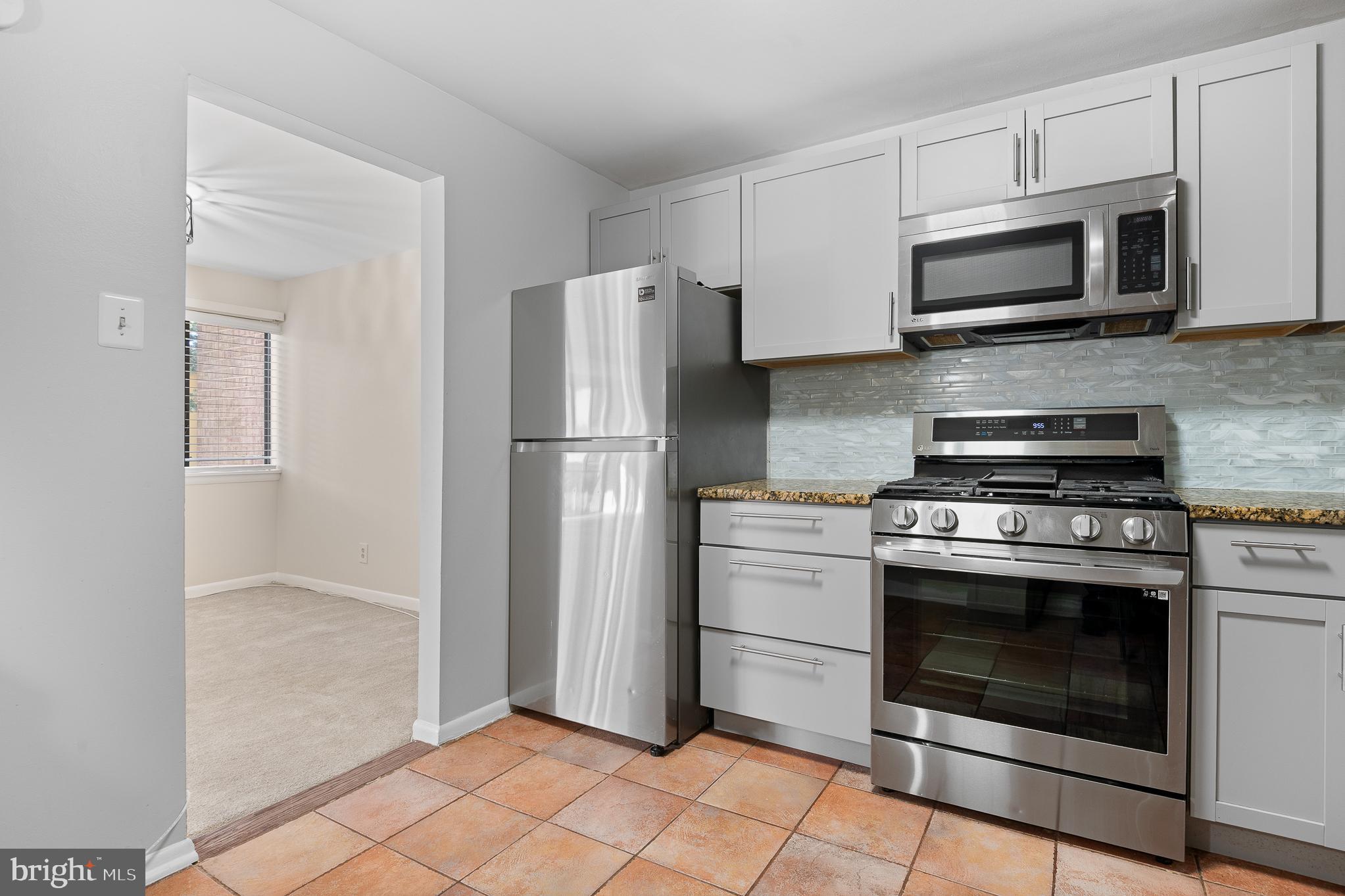 19027 Mills Choice Road, Unit 4 Gaithersburg, MD 20886 - Photo 17 of 41 Modern kitchen with sleek appliances.