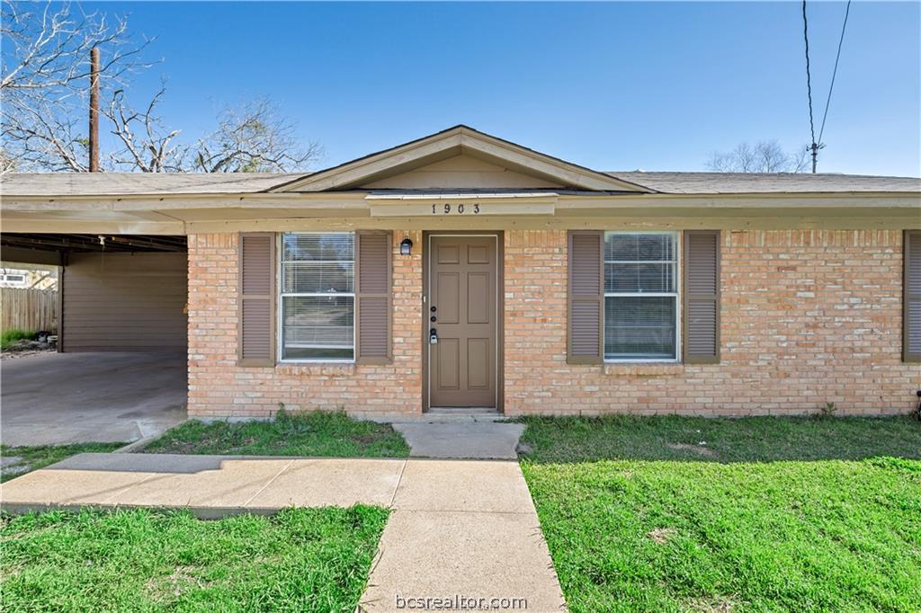 1903 Orman Street Bryan, TX 77801 - Photo 3 of 24 a front view of a house with a garden and plants