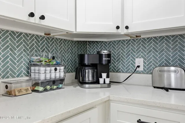 a kitchen with a sink and a microwave