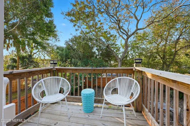 a view of a two chairs on the roof deck