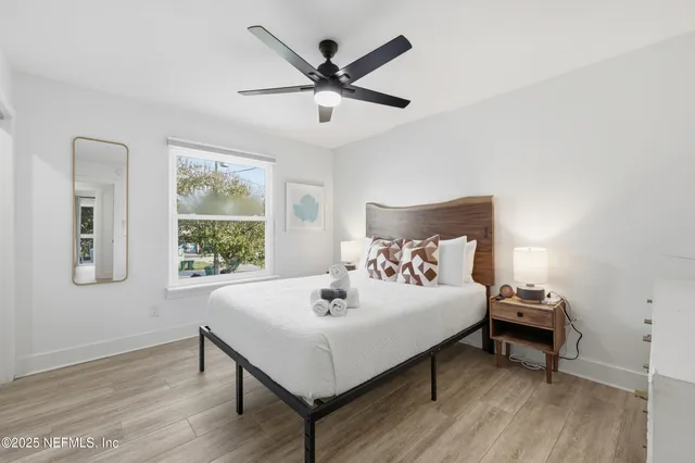 a bedroom with a bed and a window