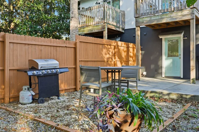 a view of a chairs and table in the patio
