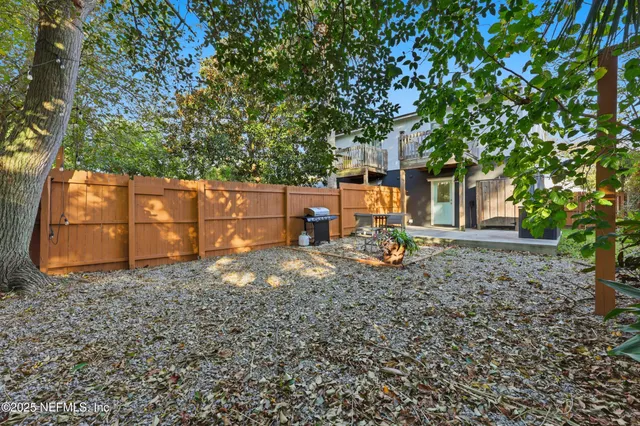 a backyard of a house with bicycles parked