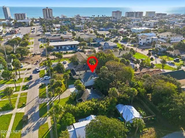 an aerial view of residential building and parking space
