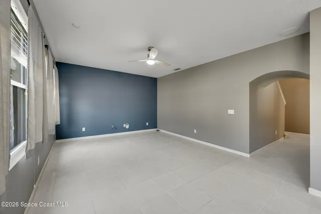 a bathroom with a granite countertop sink mirror vanity and toilet