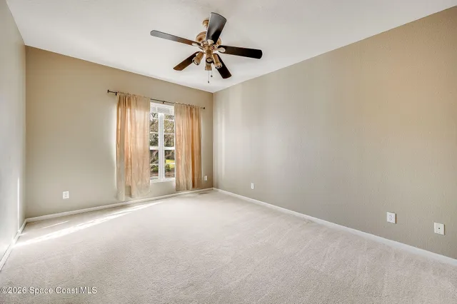 a spacious bathroom with a granite countertop tub sink and mirror