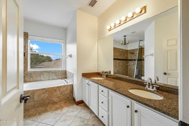 a view of a livingroom with a ceiling fan and window